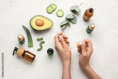 Female hands with bottles o...