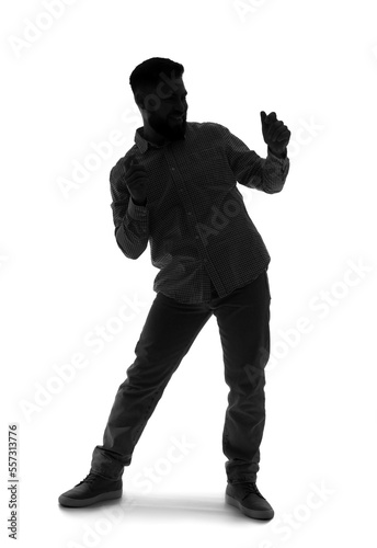 Silhouette of young man dan...