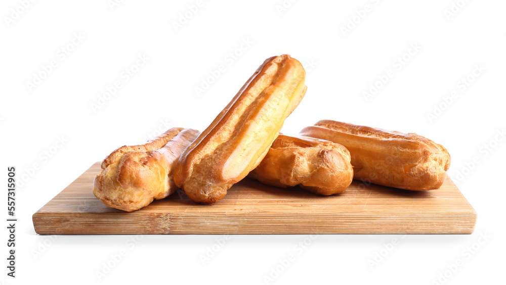 Wooden board with tasty eclairs isolated on white background Wooden board with tasty eclairs isolated on white background