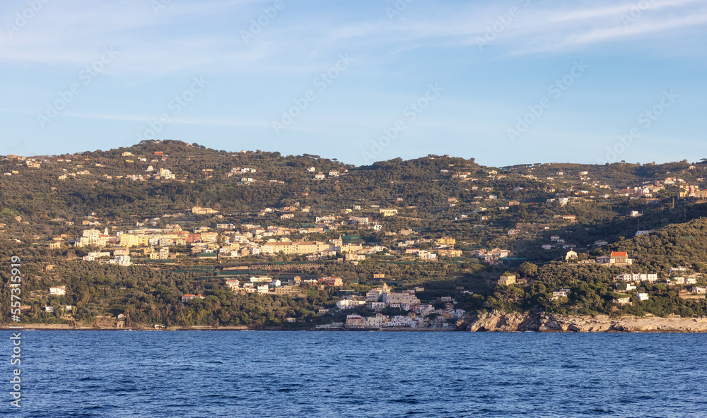 Rocky Coast and Homes near Touristic Town, Sorrento, Italy. Amalfi Coast. Sunny Evening Rocky Coast and Homes near Touristic Town, Sorrento, Italy. Amalfi Coast. Sunny Evening