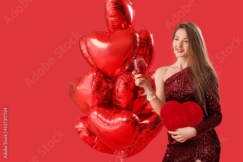 Young woman with glass of w...