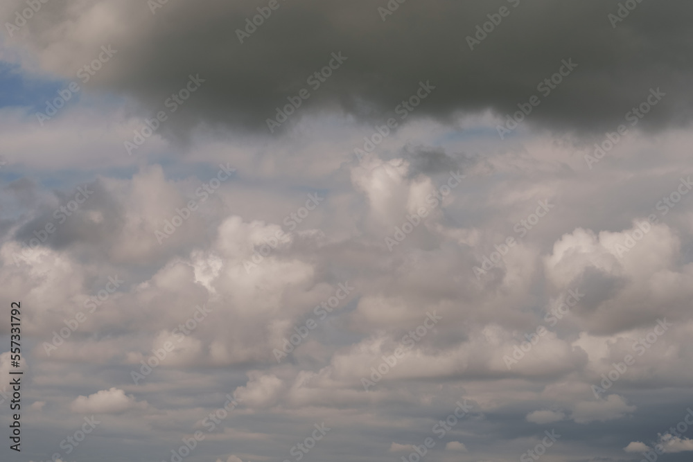 White cumulus clouds on a blue sky