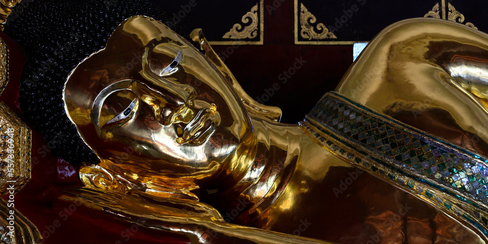 Head of reclining statue of buddha, in asian temple