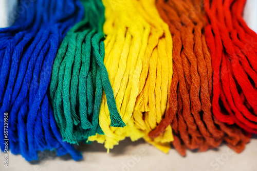 Woolen threads of different colors for knitting clothes and making various crafts. Close-up photo