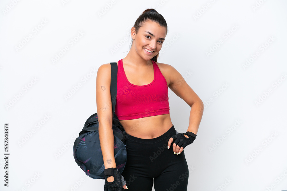 Obraz premium Young sport woman with sport bag isolated on white background laughing