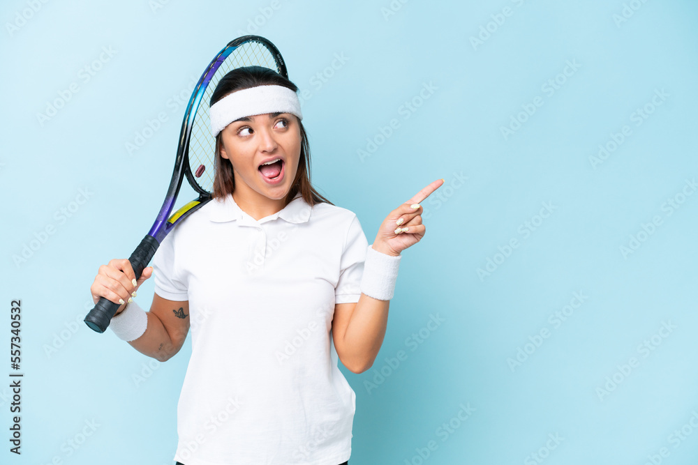 Young tennis player woman isolated on blue background intending to realizes the solution while lifting a finger up Young tennis player woman isolated on blue background intending to realizes the solution while lifting a finger up