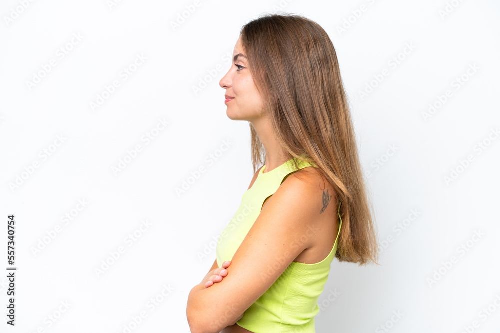 Young caucasian woman isolated on white background in lateral position Young caucasian woman isolated on white background in lateral position