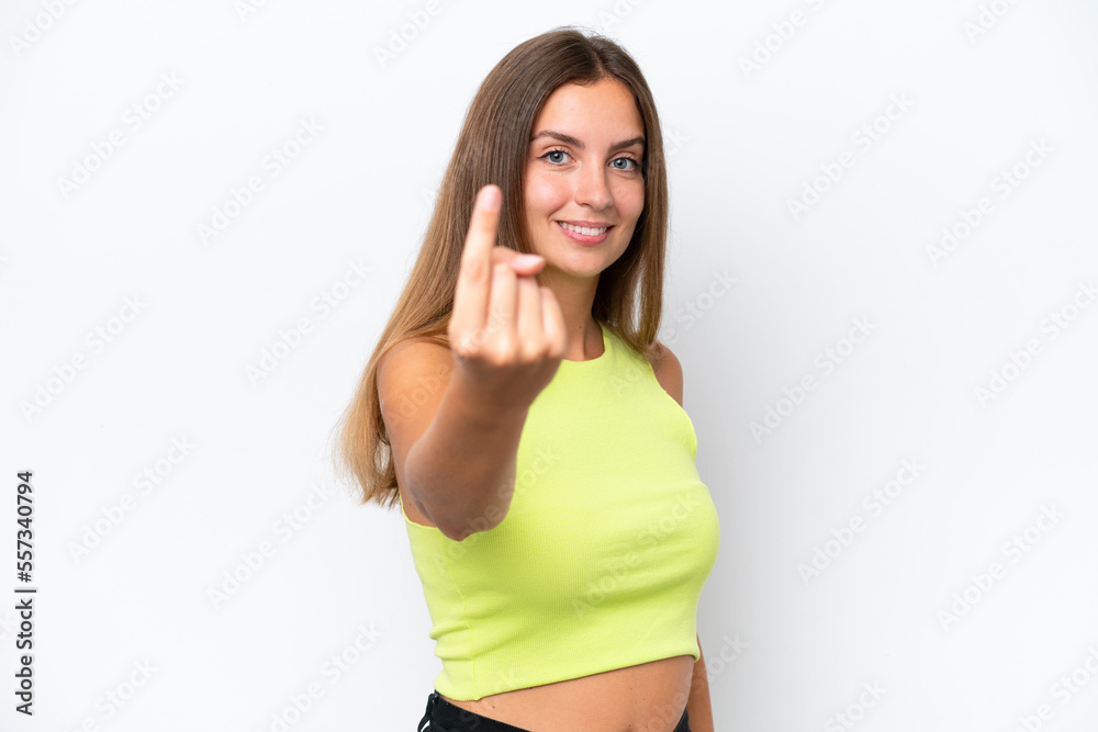Young caucasian woman isolated on white background doing coming gesture Young caucasian woman isolated on white background doing coming gesture