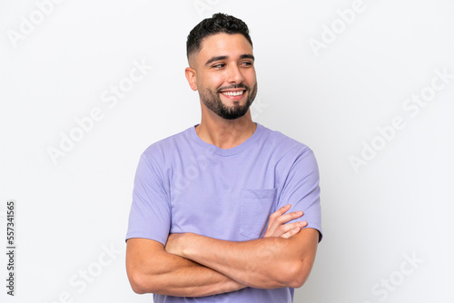 Young Arab handsome man isolated on white background looking to the side and smiling photo