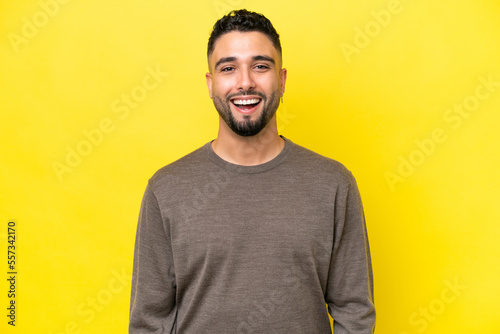 Young Arab handsome man isolated on yellow background with surprise facial expression
