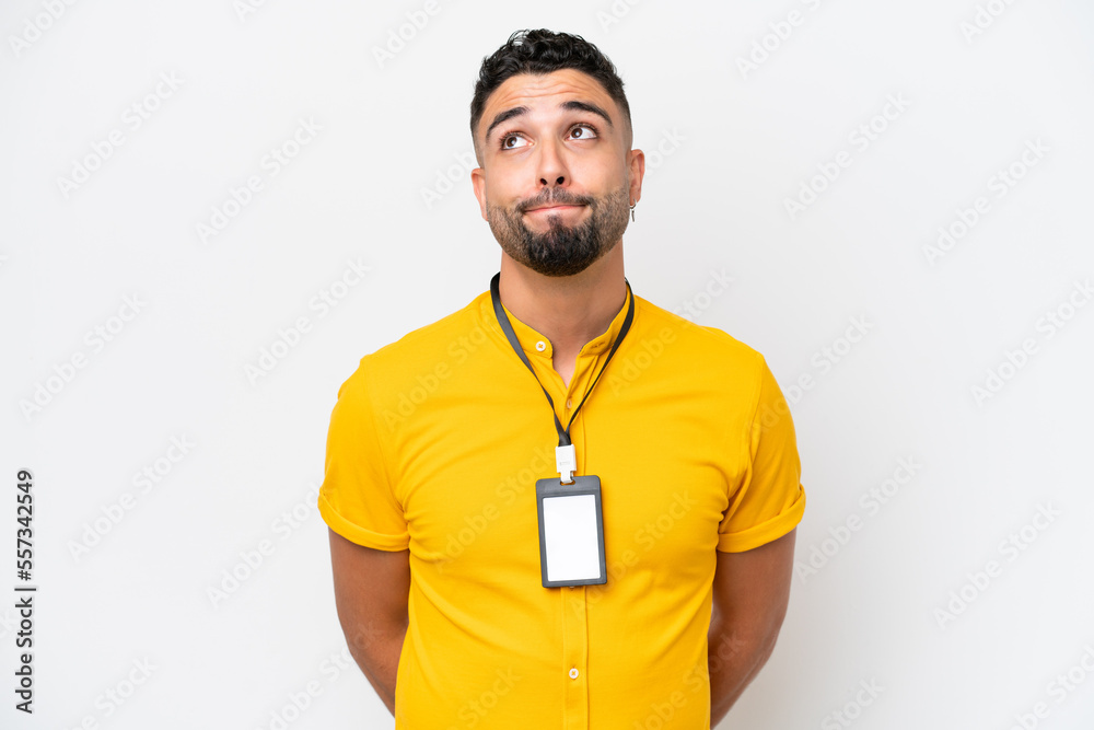 Young Arab man with ID card isolated on white background and looking up Young Arab man with ID card isolated on white background and looking up