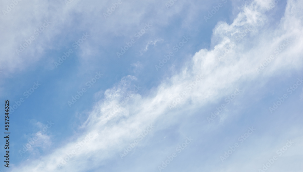 Panoramic photo of blurred sky. Blue sky background with cumulus clouds