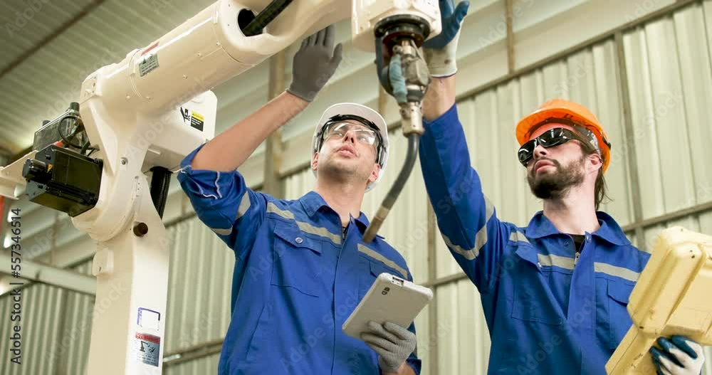 Specialist robotic engineers maintenance and control robot arm in factory, Innovation automation robot for industrial Specialist robotic engineers maintenance and control robot arm in factory, Innovation automation robot for industrial