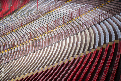 Row of Empty seats of tribune on sport stadium. Concept of fans. Chairs for audience. Empty seats  modern stadium.