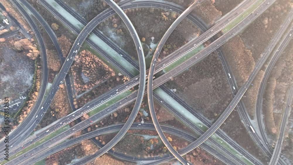 Complex traffic intersection roundabout. Symbolic for choice, direction, route. rond point de grand bigard near Brussels. Belgium. E19. Aerial drone overhead top down view.