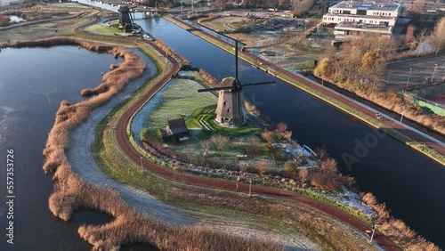 Strijkmolen E, Ouddorp, Alkmaar, North Holland,The Netherlands. Oak octagonal polder mill from 1630. Ironing mills do not drain polders, grind the water from one reservoir to the other. Winter aerial. photo