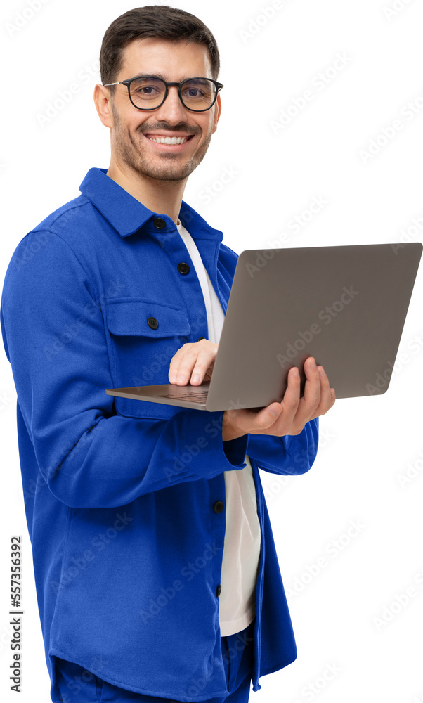 Portrait of young modern businessman standing holding laptop and looking at camera with happy smile - obrazy, fototapety, plakaty 