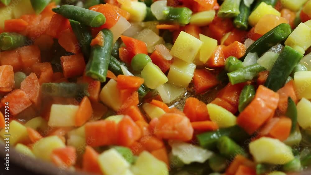 natural chopped vegetables are fried in a frying pan natural chopped vegetables are fried in a frying pan