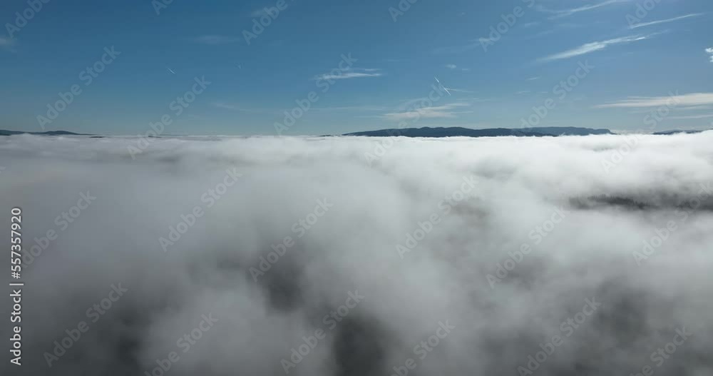 Drone flight over the clouds during sunrise. Fly through the clouds. Fresh morning and amazing sun rays over cloudscape. Drone flight over the clouds during sunrise. Fly through the clouds. Fresh morning and amazing sun rays over cloudscape.