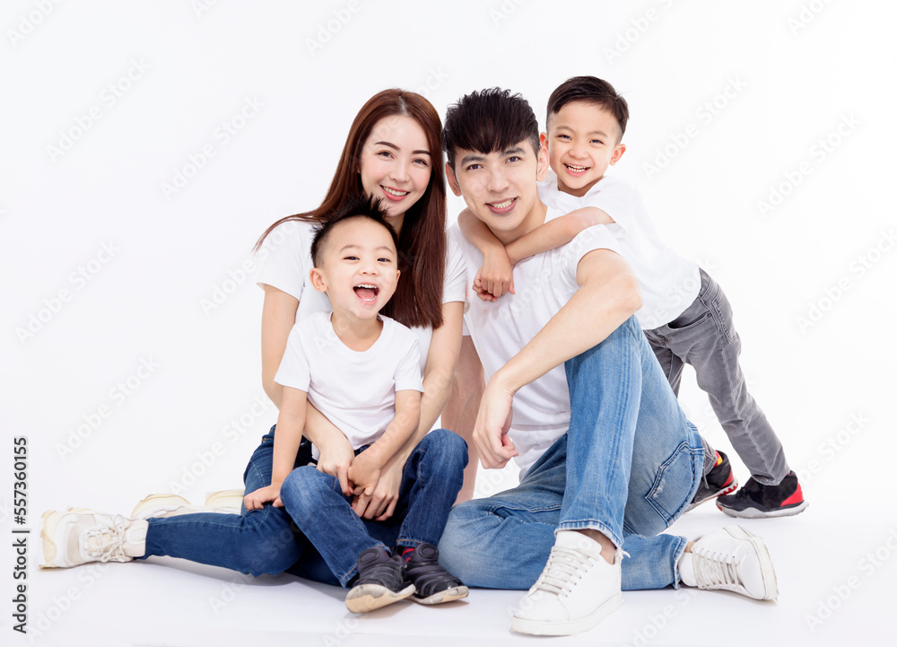 Happy Asian family and kids sitting on white floor Happy Asian family and kids sitting on white floor