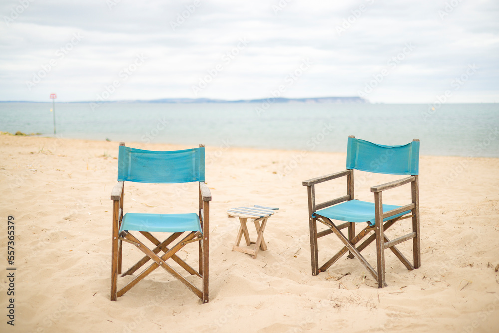 Chairs on a beach. Dorset coast with view of Isle of Wight, UK