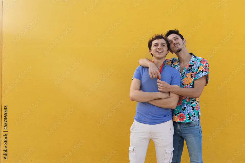 Happy young couple embraces. Two men enjoy outside. Happy young couple embraces. Two men enjoy outside.