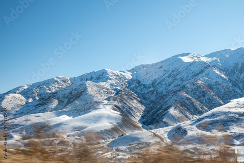 Winter mountain with white snow peak. Panoramic view of snowcapped mountains. Winter. beautiful clear blue sky in daylight. impressive view of the mountain peaks