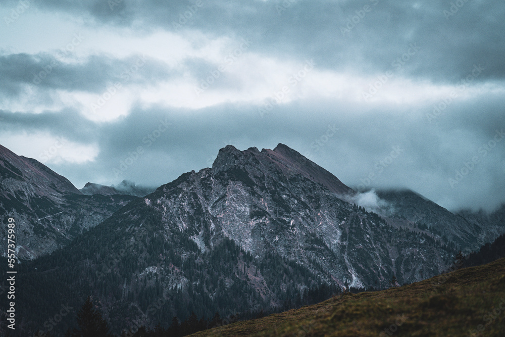 Scenic mountain view under a cloudy dramatic sky Scenic mountain view under a cloudy dramatic sky