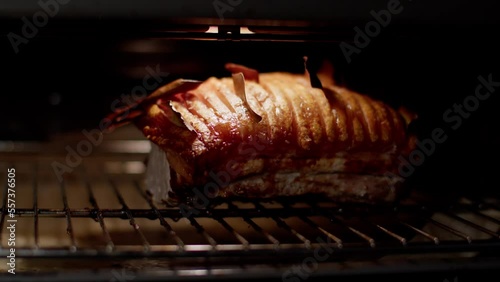 Traditional Danish Pork Meal called Flæskesteg. Pig Meat with Skin roasting in the Oven.