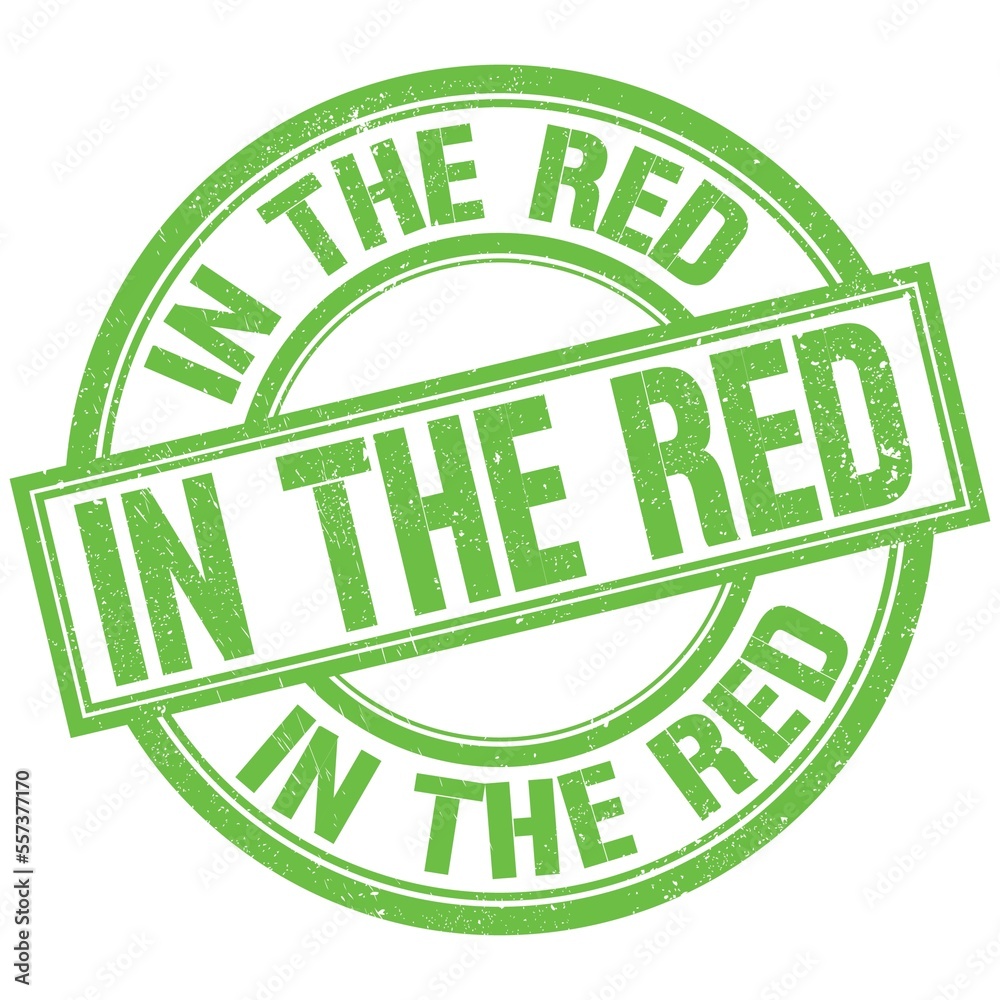 IN THE RED written word on green stamp sign IN THE RED written word on green stamp sign