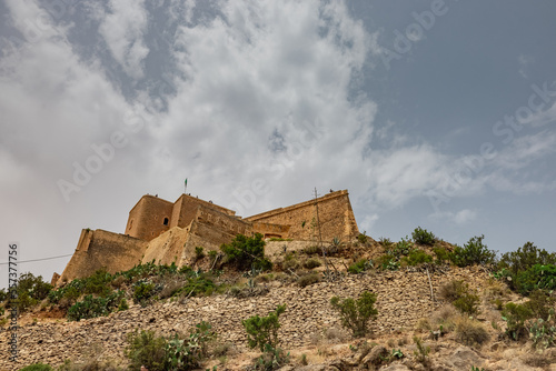 Looking up towards the Santa Cruz fortress, one of the three forts in Oran, the second largest port of Algeria; Summer day, looking from high above towards the city. photo