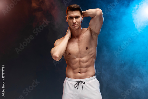 Portrait of masculine proud confident muscular man with naked nude torso