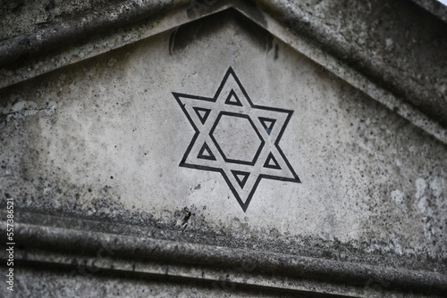 Star of David on a tombstone in a Jewish cemetery. photo