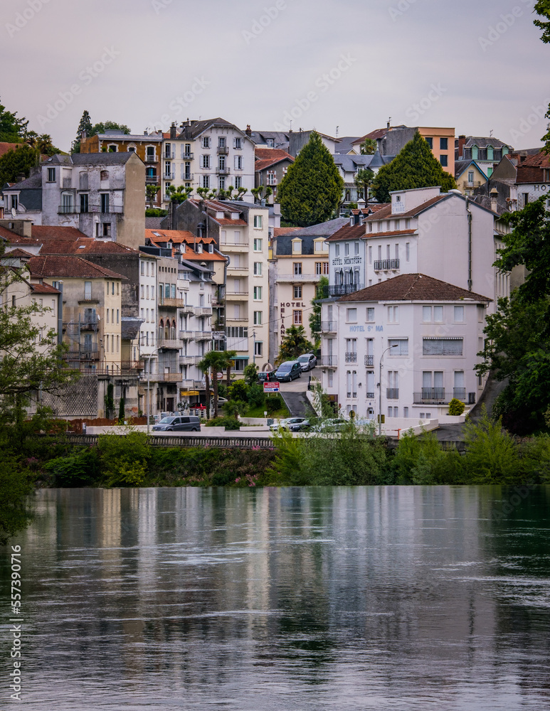 Riverbanks of the Gave de Pau river in the pilgrimage city of Lourdes in the French Pyrenees
