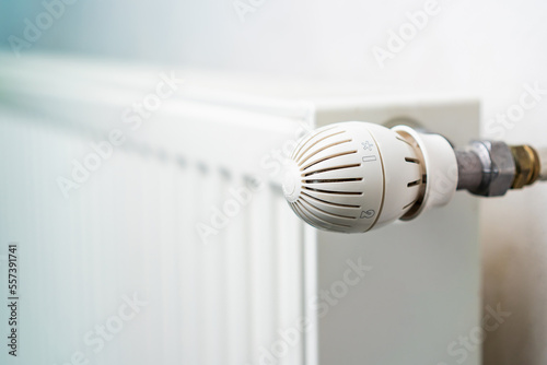 Faucet or temperature regulator on the radiator of the heating system, selective focus. Background