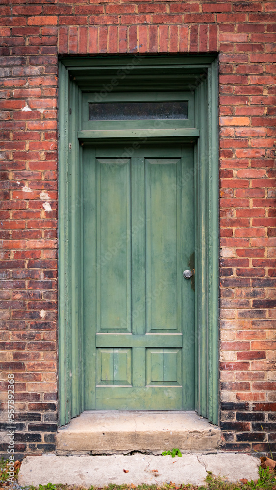 A green door on an abandoned brick building that was once a thriving business in the town of Thurmond. Thurmond is a town in Fayette County, West Virginia, United States, on the New River. A green door on an abandoned brick building that was once a thriving business in the town of Thurmond. Thurmond is a town in Fayette County, West Virginia, United States, on the New River.