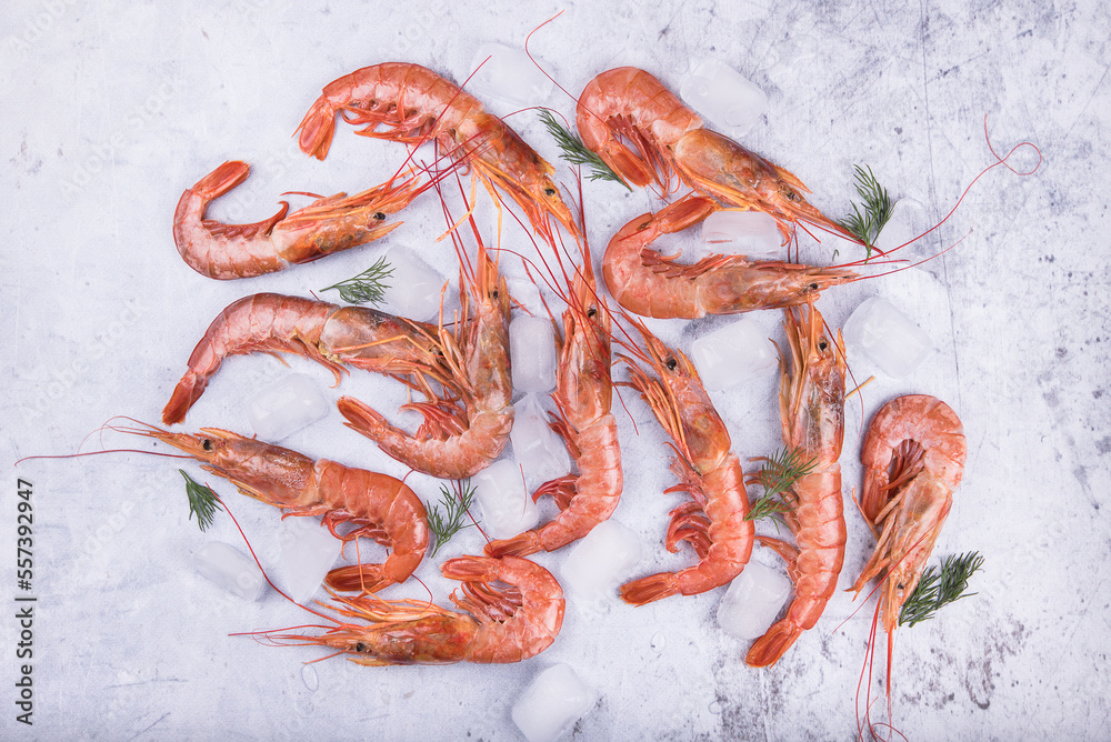 Fresh langoustines on a marble table, top view.