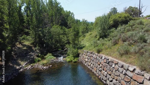 Flying through the dam of the old power station at the Boeza river, El Bierzo, Spain. photo