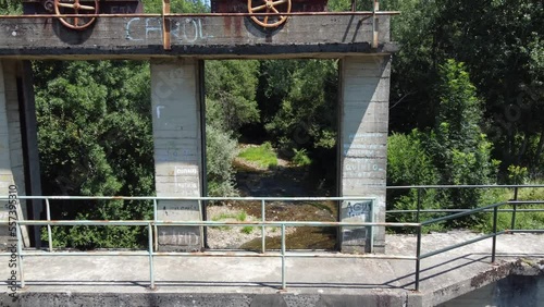 Flying through an old power station dam. Boeza river, El Bierzo, Spain photo