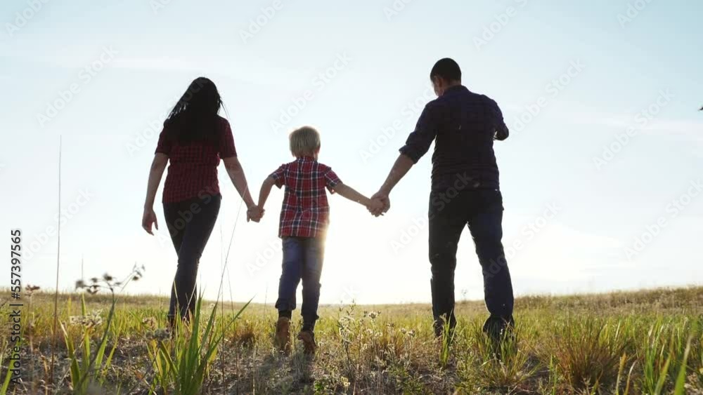 people in the park. happy family silhouette walk in the forest. mom dad and daughters walk holding hands in the park. happy family childhood concept. parents and children are walk in dream nature people in the park. happy family silhouette walk in the forest. mom dad and daughters walk holding hands in the park. happy family childhood concept. parents and children are walk in dream nature