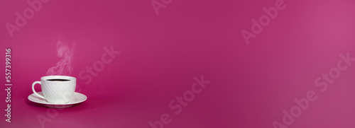 Isolated white cup mug with a hot coffee tea with steam on a pink background. A beautiful romantic extra wide banner with copy space. Minimalism style, blank gradient background, free space for text