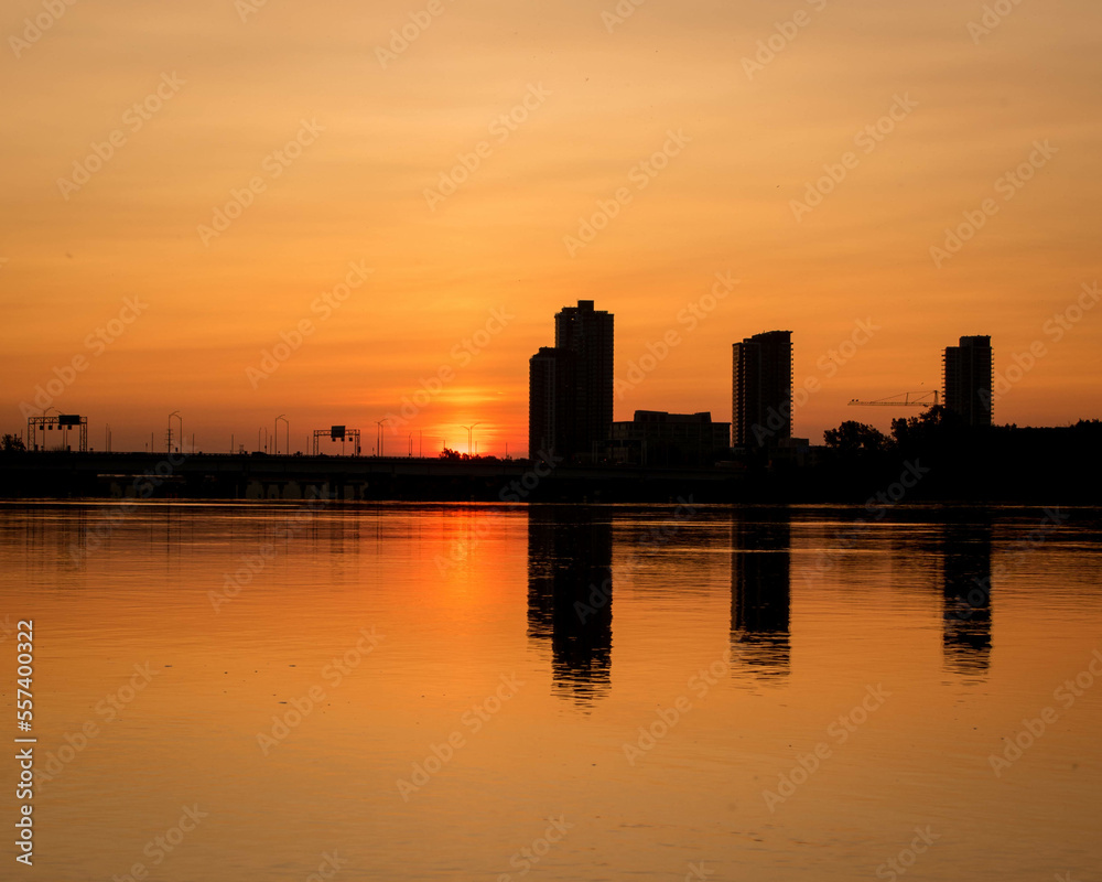 sunrise.sunrise over the city of montreal.background panorama scenic of the strong sunrise and cloud on the orange sky.Evening cloudscape in city