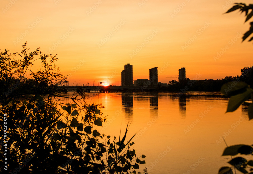 sunrise.sunrise over the city of montreal.background panorama scenic of the strong sunrise and cloud on the orange sky.Evening cloudscape in city