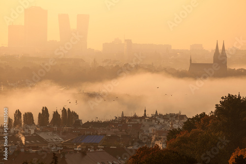 Modern and Historical - Prague, Bohemia, Czech Republic at sunrise , Vysehrad in mist