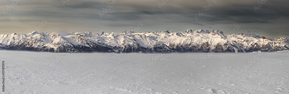 Beautiful mountain panorama of the alps, in winter at high altitude. Shooting at a height of 2700 m. Nice view in the background, on the mountain range of the "Écrins" national park. French alps. - obrazy, fototapety, plakaty 