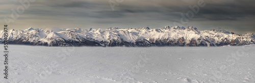 Beautiful mountain panorama of the alps, in winter at high altitude. Shooting at a height of 2700 m. Nice view in the background, on the mountain range of the "Écrins" national park. French alps.