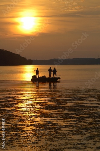 A trio of angler fsihing at sunset 