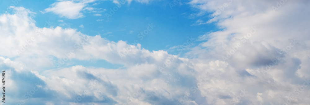 Sunlit white clouds in the blue sky Sunlit white clouds in the blue sky