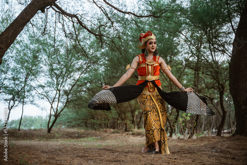 portrait young women presenting traditional Javanese dance movements