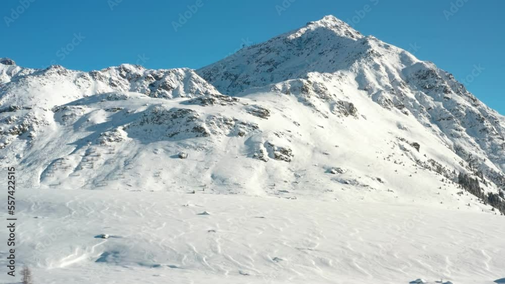 Aerial view of beautiful winter wonderland mountain scenery with trees covered by snow. Scenic view of snowcapped mountain, december landscape, drone video. Snowy valley in alps during winter. Aerial view of beautiful winter wonderland mountain scenery with trees covered by snow. Scenic view of snowcapped mountain, december landscape, drone video. Snowy valley in alps during winter.